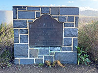 Mule Hill Monument on Pomerado Road near 1-15. A large brass plack on a rocky block base.