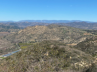 View of boulder-cover mountainsides along San Pasqual Valley near Raptor Ridge.