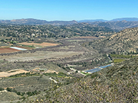Zoom view looking across San Pasqual Valley to the northeast toward Valley Center highlands.