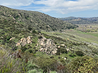 View from a pull off along Bandy Canyon Road that overlooks the Raptor Ridge Trail descending into San Pasqual Valley.