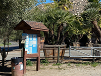 Coast To Crest Trail staging area kiosk in the parking area at trailhead.