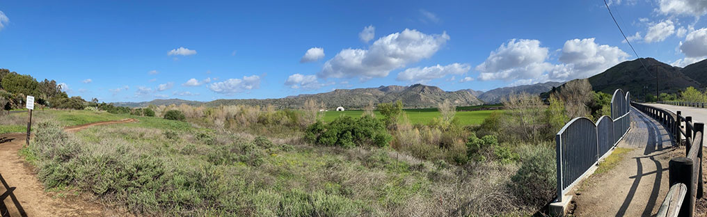 Panoramic view taken near the west end of the Bandy Canyon Road bridge over Santa Marial Creek showing the Coastal Sage Scrub and riparian plant communities.