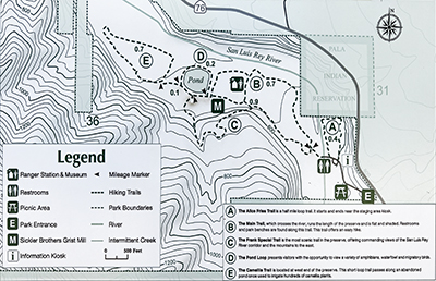 Trail map of the Wilderness Gardens Preserve on a base topography map. Legend show locations of park features including picnic area, restrooms, and ranger station.