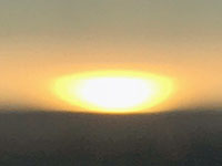 Zoom view of a sunset on the Pacific Ocean from Palomar Mountain.