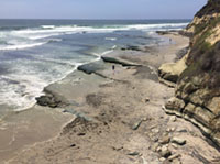 Bedrock and tide pools exposed at Swamis State Beach.