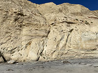 A normal fault offsets massive blocks of Torrey Sandstone (down on the left) on Black Beach.