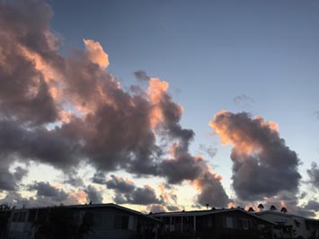 Cumulus congestus clouds build into morning altocumulus clouds over Double Peak in San Marcos Calofornia