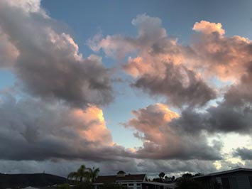 Morning cumulus congestus clouds building into altocumulus clouds over San marcos, CA