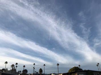 Cirrus fibratus moving in advance of a warm front coming off the Pacific Ocean.