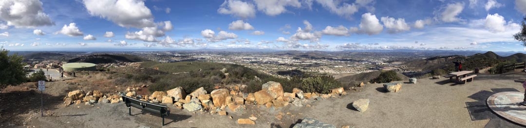 Cumulus humilis (fair weather clouds) over San Marcos and Escondido and mountains beyond to the east as seen from Double Peak in San Diego County, CA