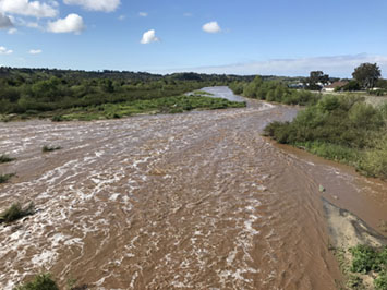 Flood on the San Luis Rey River in Oceanside, CA near peak flow on April 11, 2020.