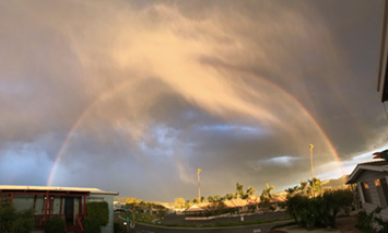 A rainbow in an afternoon thunderstorm over San Marcos, California