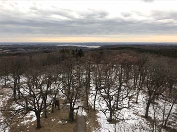View looking west from the top of the Lapham Peak observatory tower at gentle landscape of Wisconsin.