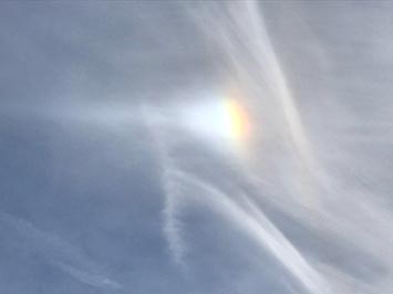 Parhalia (sun dog) in cirrus cloud layer & contrails