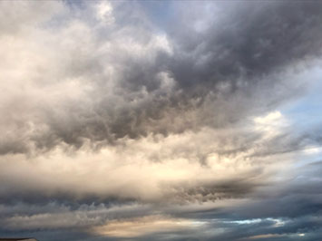 Mammatus on the base of altocumulus clouds.