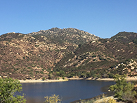 Looking across Lake Poway with the Mt. Woodson Trail ascending the slope.