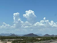 Volcanic block-faulted mountain and sediment-filled basin typical of Basin and Range landscape in southwestern Arizona.