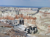 Coal Mine Mesa near Tuba City, AZ has a cap of Cretaceous Dakota Formation over cliffs of Jurassic Entrada Sandstone.