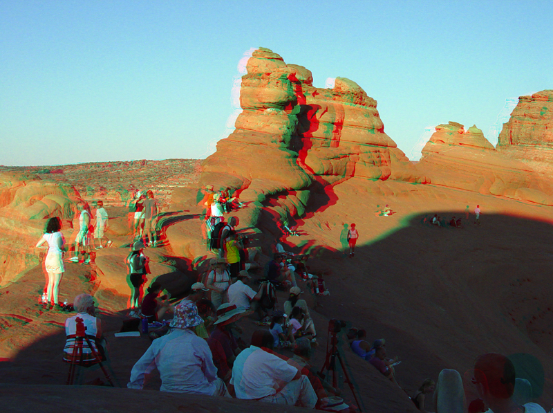 People watching sunset at Delicate Arch.