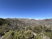 View looking north at the crest of the Chiracahua Mountains. Cochise Head is the name of the rugged volcanic peak in the middle. This view is from the Massai Point Trailhead area.