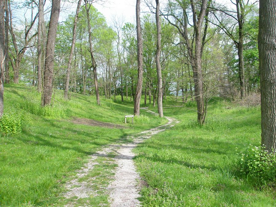 The Shawnee Lookout Trail follows a ditch between ancient earthworks in the forest