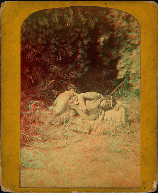 A woman in native dress laying asleep on a blanket