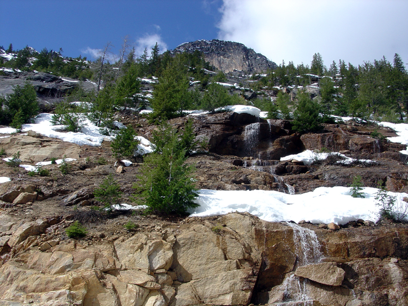 Melting snow and cascades on granite along the North Cascades Highway