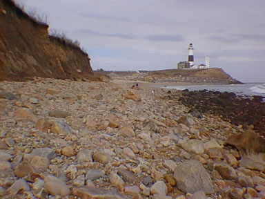 Boulder-covered beach and seacliff near Monmouth Point Lighthouse