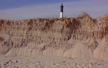 Fire Island Lighthouse with storm-eroded shore dunes
