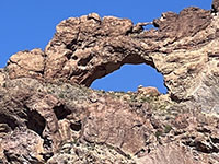 Zoom view of the arch in Arch Canyon from along Ajo Mountain Drive.