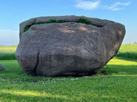 One of the Three Sisters, large glacial erratic granite boulder.