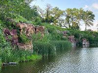 Precambrian-age Souix Quartzite Formation exposed along a quarry wall next to the lake in Pipestone National Monument.