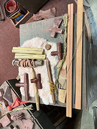 Examples of crated pipes and stone art object in a display in the Visitor Center.