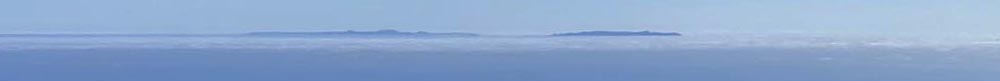 Santa Monic Mountain National Recreation Area. View of the higher peaks above the clouds (marine layer) of the Channel Island offshore of the coast of the Santa Monica Mountains.