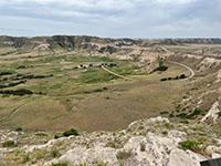 View of the valley near the Scotts Bluff Visitor Cenenter showing the park road that leads to the top of the bluff.