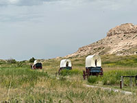 Wagon train on display on the Oregon Trail through Mitchell Pass near the Visitor Center.