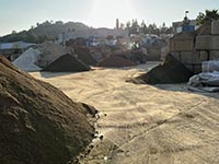 Piles of various kinds (and colors) of sand used in construction.