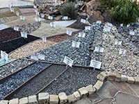A display of various kinds of gravels and crushed stone used for decorative yard construction (derived from many different sources).